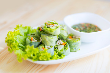 Fresh spring rolls on wood - Side view