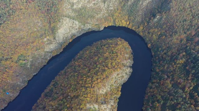 Beautiful Vyhlidka Maj, Lookout Maj, near Teletin, Czech Republic. Meander of the river Vltava surrounded by colorful autumn forest viewed from above. Tourist attraction in Czech landscape. Czechia.