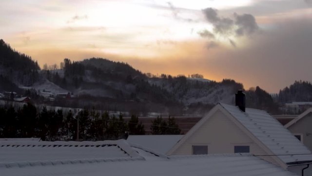 Snow blowing off a roof top