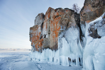 Fototapeta na wymiar Icicles in Oltrek island rock. Winter landscape of Lake Baikal.