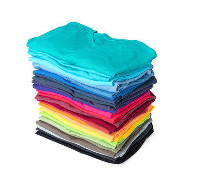 Stack of colorful t-shirt isolated on white background. File contains a path to isolation.