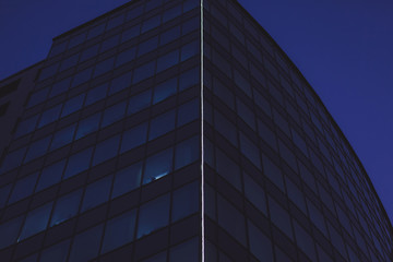 Obraz premium glass modern office building at night