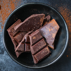 chocolate (delicious cocoa dessert, pieces of sweets) menu concept. food background. top view. copy space