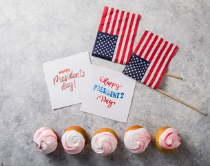 Fototapeta na wymiar Word Happy Presidents day, February 17. Patriotic Baking Supply Cup Cake Holders for holiday and july 4th concepts.