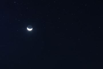 New moon and stars in the sky
