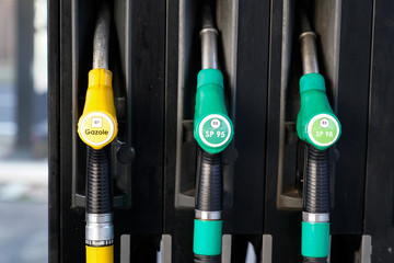 Fuel crane gaz equipment filling guns at the gas station