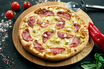 Delicious close up view on Spicy sliced pizza with salami, onion and chili. Traditional italian cuisine.