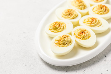 Classic devilled eggs with smoked paprika. Selective focus, copy space.