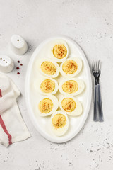 Classic devilled eggs with smoked paprika. Top view, copy space.