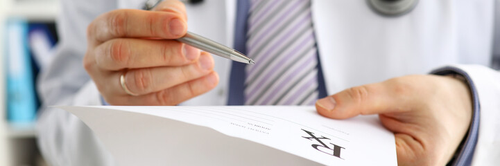 Male medicine doctor hand give prescription to patient
