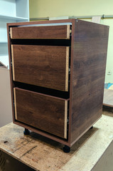 Assembly of hard furniture, close-up drawers for drawers