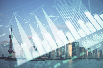 Forex graph on city view with skyscrapers background double exposure. Financial analysis concept.