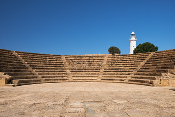 The ancient Odeun and lighthouse on the background. Paphos Archaeological Park. Cyprus