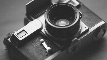 Vintage style film camera. Art photo wallpaper background.