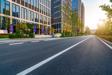 Obraz premium Road pavement and modern building in Jinan financial district