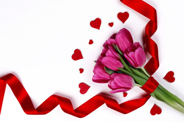Tulip flowers and hearts on white