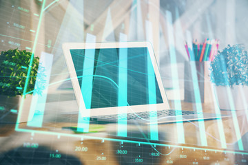 Forex market graph hologram and personal computer on background. Multi exposure. Concept of investment.