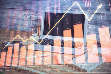 Double exposure of forex chart and work space with computer. Concept of international online trading.