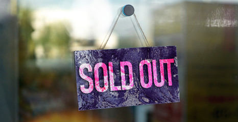 the sold out text on board hang on the store glass design, sales season