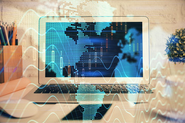 Stock market chart hologram drawn on personal computer background. Multi exposure. Concept of investment.
