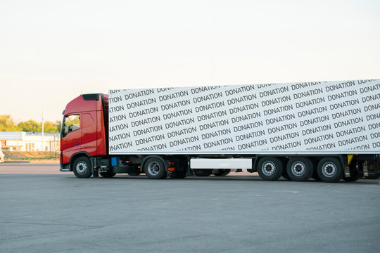 a huge truck move with donation supplies inside, help to the poor coutries on the earth