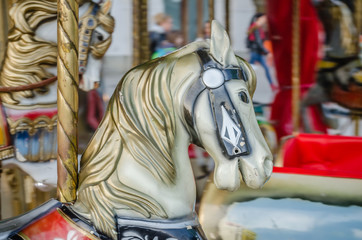 Obraz na płótnie Canvas Novi Sad, Serbia - December 13. 2019: Downtown Novi Sad. The decorations on the children's carousel with wooden horses