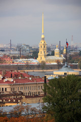 Skyline: Waterfront at the Neva river and the golden spire of the Peter and Paul Cathedral - seen from St. Isaac Cathedral in St. Petersburg, Russia