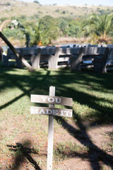 A wooden sign that reads 