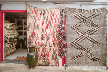 Moroccan  carpets in the street shop souk of Asilah, Morocco