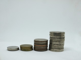 Several Thai coins isolated on white background, heap of coins silver gold, copper thai coin, baht currency.