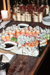 A large variety of sushi at an event