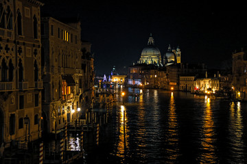 Fototapeta na wymiar Night view of the Basilica di Santa Maria della Salute and the Canal Grande in Venice, Italy