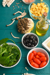 Salad ingredients, fresh and healthy nutrition. Vegetarian food. Top view. Menu, recipe book. Vertical frame.