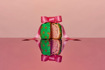 Painted pork pie with a pink ribbon on top