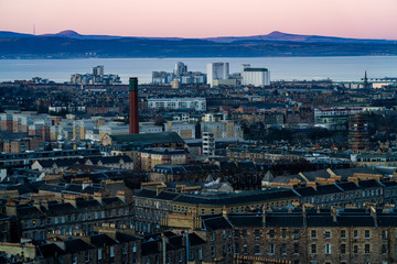 Fototapeta na wymiar View over the City of Edinburgh towards Leith Docks and the Firth of Forth from Carlton Hill