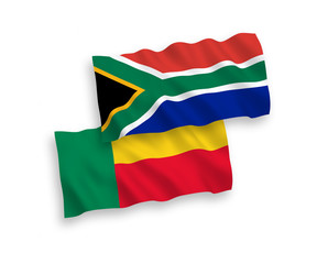 National vector fabric wave flags of Benin and Republic of South Africa isolated on white background. 1 to 2 proportion.