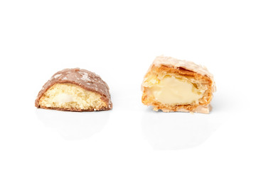Coconut eclairs or custard cookies isolated on white background.