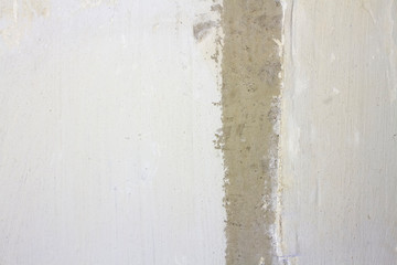 Fototapeta premium concrete wall with cement plaster with a strip in the middle