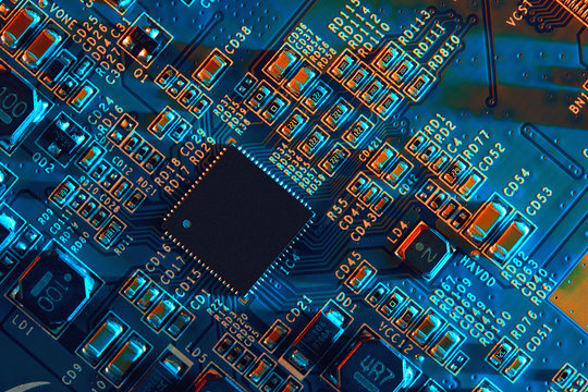 Electronic circuit board with electronic components such as chips close up. The concept of the electronic computer hardware technology.	