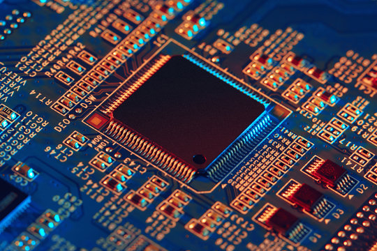 Electronic circuit board with electronic components such as chips close up. The concept of the electronic computer hardware technology.	
