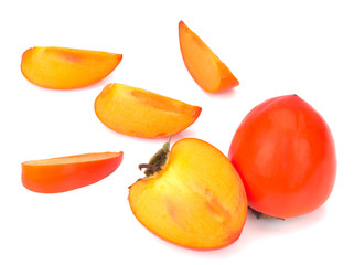 fresh ripe persimmon and its slices isolated on white background
