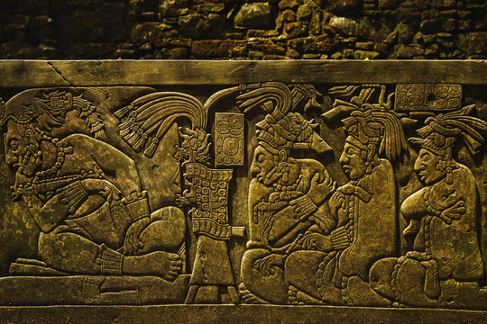 Ancient Mayan drawings on the stone wall