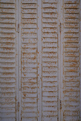 Old weathered real rusty steel door wallpaper metal background texture