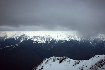 Fototapeta na wymiar winter mountain landscape under gray clouds