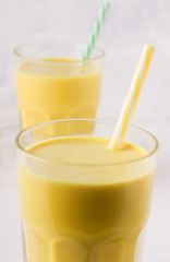 two glasses with golden milk close-up. latte turmeric