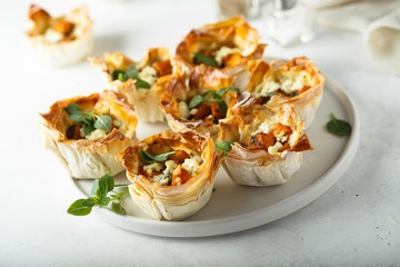 Pumpkin cheese tarts with basil