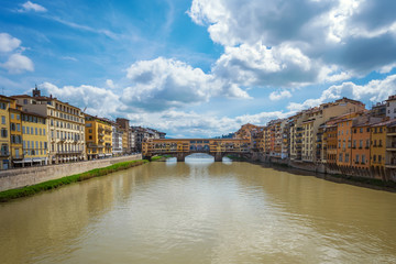 Fototapeta na wymiar Panoramic day view of famous Ponte Vecchio over Arno River in Florence, Italy.