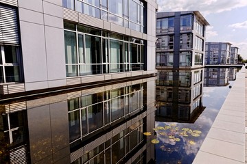 Office buildings reflecting in the water