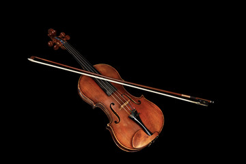 Old classic violin with bow isolated on black background