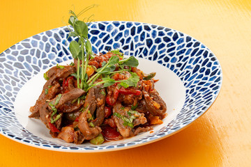 Asian lamb heart in tomato sauce, coriander and spices